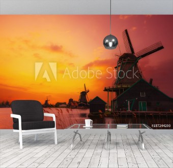 Picture of Traditional Dutch windmills on the canal bank at warm sunset light in Netherlands near Amsterdam